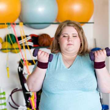 An older woman doing fat farm exercises at Weight Crafters.